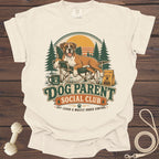Dog Parent Social Club graphic on a cream t-shirt with a boxer dog.