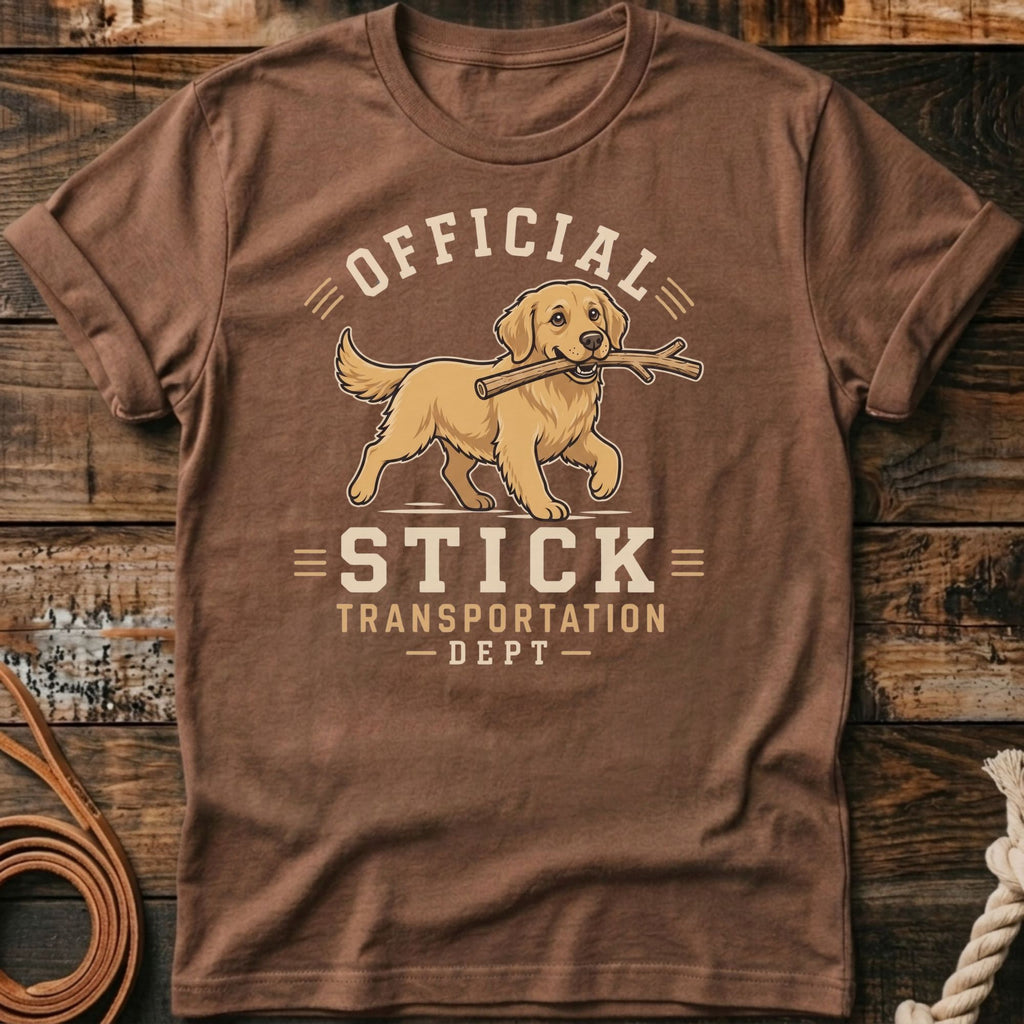 Brown t-shirt with a golden retriever carrying a stick, text reads "OFFICIAL STICK TRANSPORTATION DEPT".