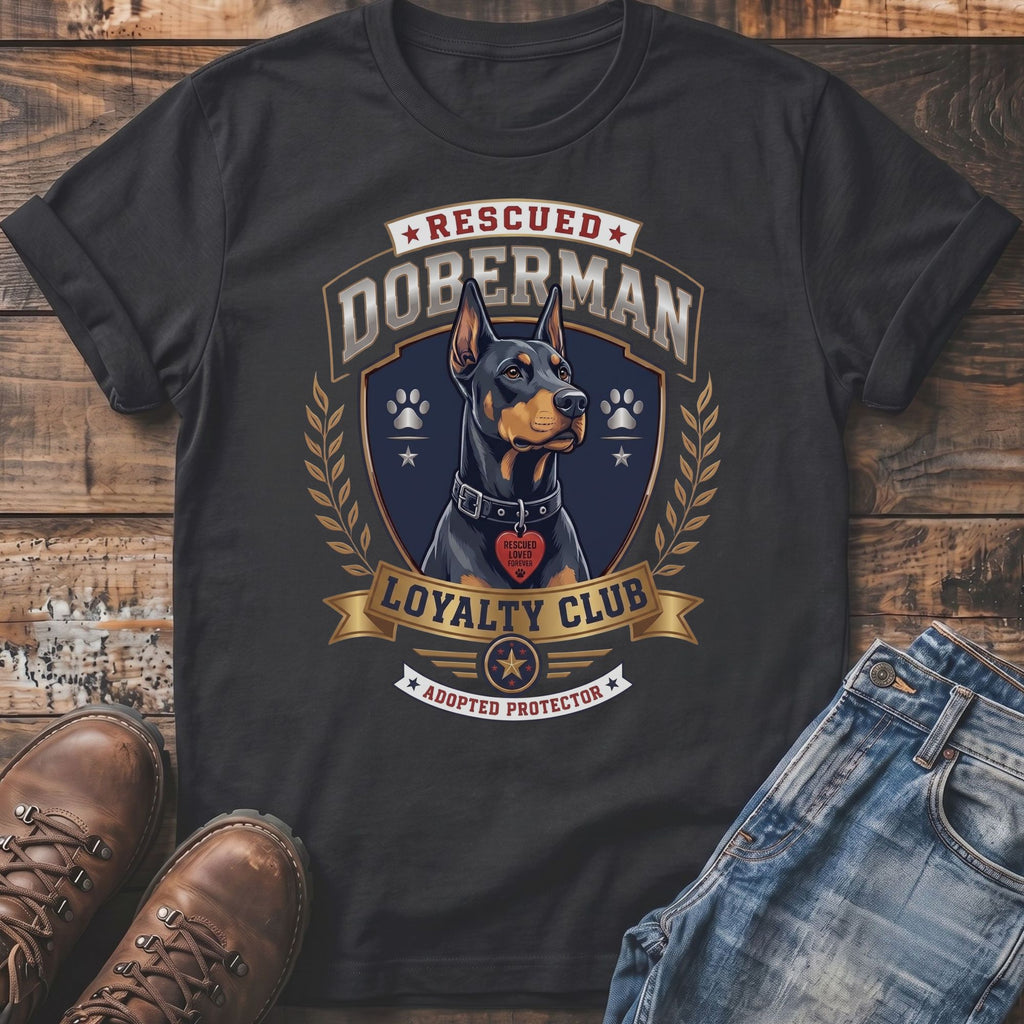 Rescued Doberman Loyalty Club adopted protector graphic on a dark t-shirt.