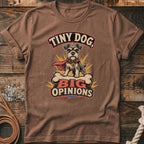 Brown t-shirt with a graphic of a schnauzer wearing a cape and the text "Tiny Dog, Big Opinions."