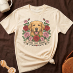 Cream t-shirt with golden retriever surrounded by red and pink roses. Text: Loyal Love Blooms.