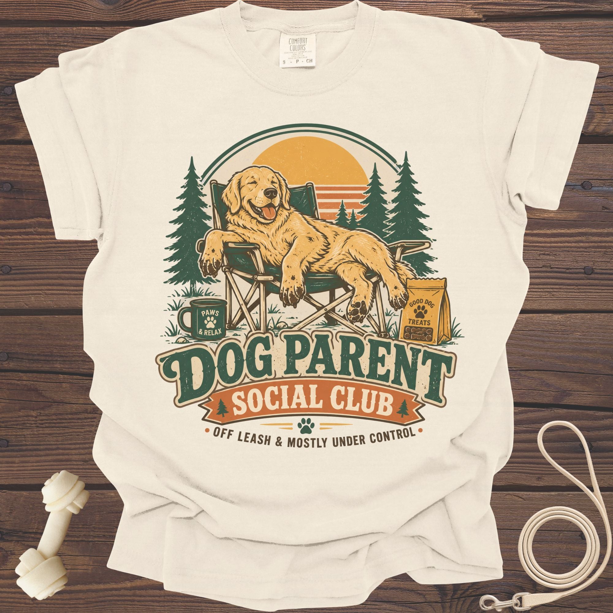 Graphic t-shirt with a Golden Retriever relaxing in a camping chair with "Dog Parent Social Club" text.