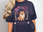 Dark navy t-shirt with a Pomeranian dog and cherry blossoms, text reads "Soft Heart Loyal Soul".