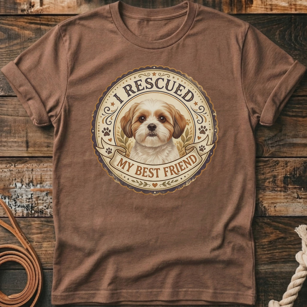 Brown t-shirt with a circular graphic featuring a dog and text "I RESCUED MY BEST FRIEND".