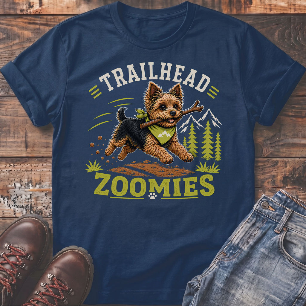 Yorkshire terrier running with stick on navy t-shirt with "TRAILHEAD ZOOMIES" text.