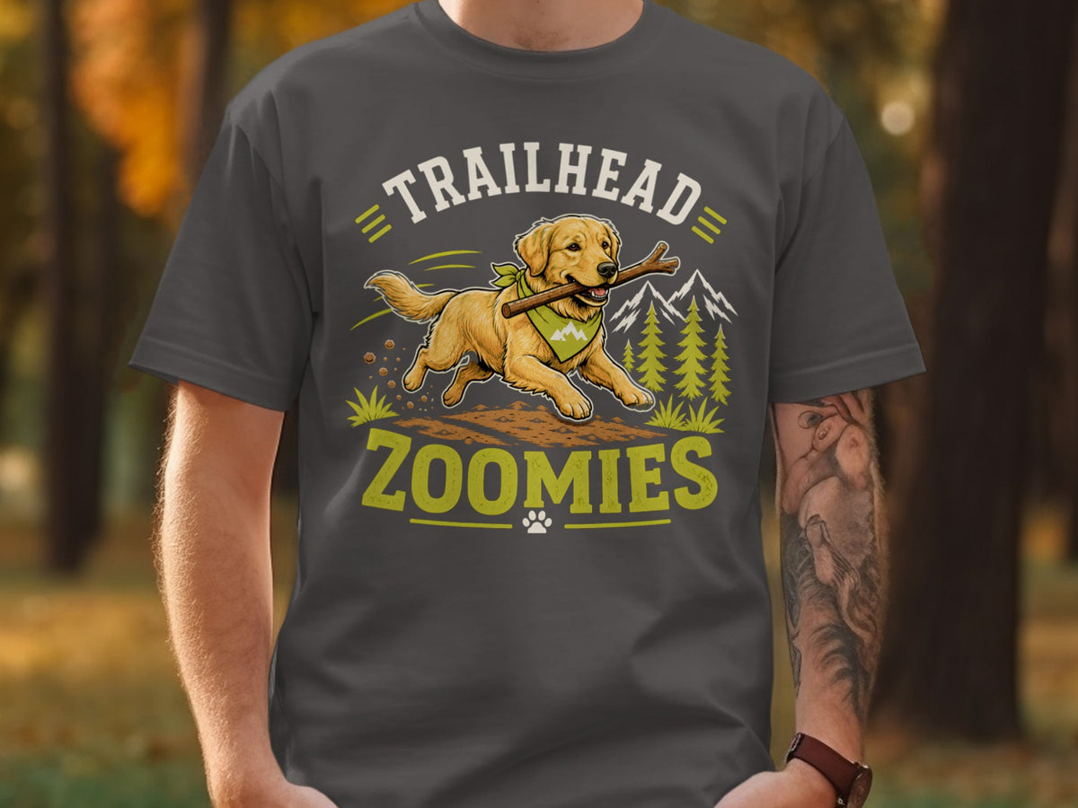 Golden retriever running with stick on shirt with "Trailhead Zoomies" text.