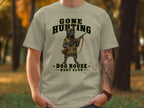 T-shirt graphic with text "Gone Hunting" and a dog holding a rifle.