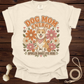 T-shirt with a corgi wearing a bandana surrounded by flowers and text.
