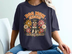 Dog Mom Energy design on navy t-shirt with a schnauzer, flowers, and text.