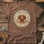 Brown t-shirt with a round graphic of a dachshund, reading "I Rescued My Best Friend".