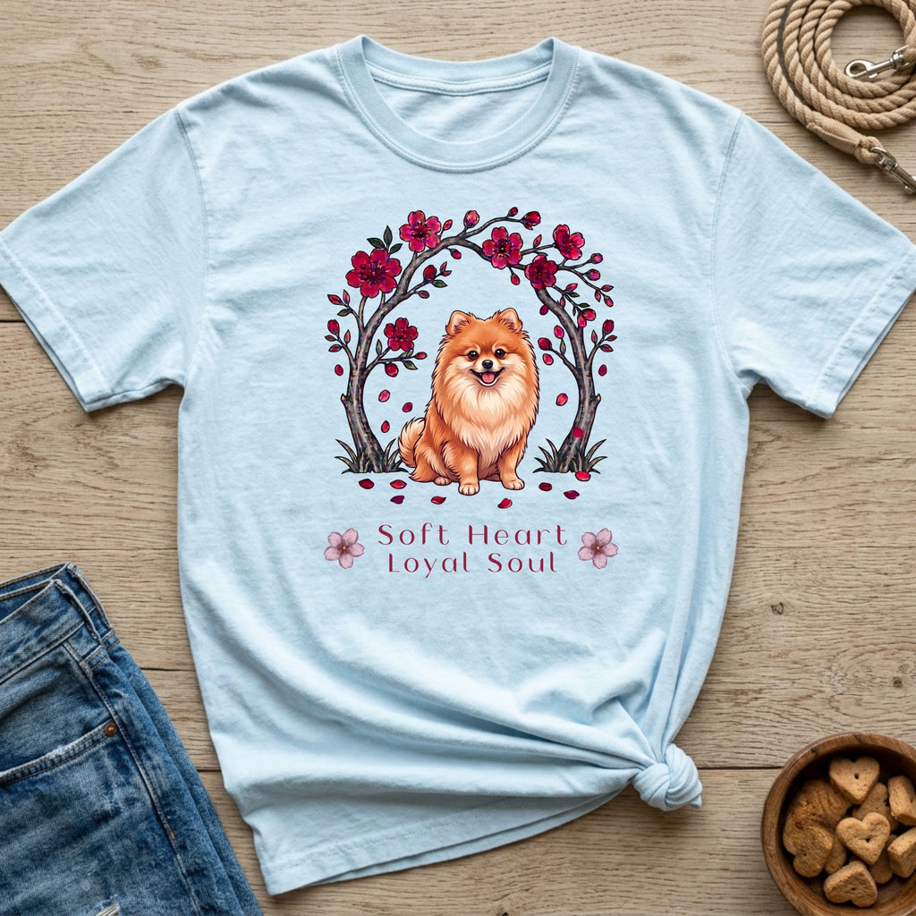 Light blue t-shirt with a Pomeranian dog under a cherry blossom tree and text "Soft Heart Loyal Soul".