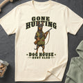 Cream t-shirt with a Doberman holding a rifle and the text "Gone Hunting Dog House Hunt Club".