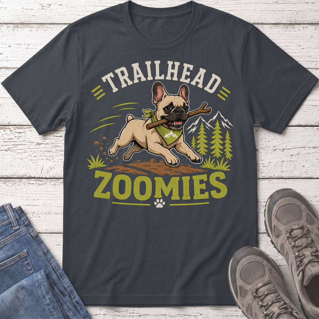 French bulldog with stick on shirt that reads "Trailhead Zoomies"