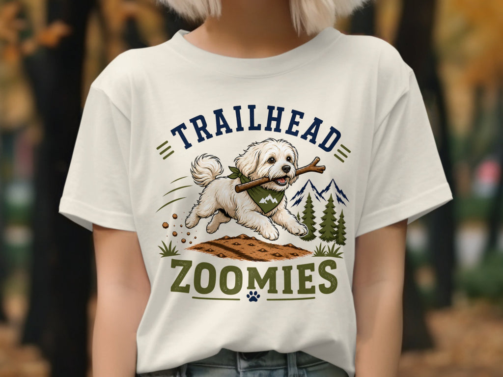 White fluffy dog with a stick in its mouth on a t-shirt.