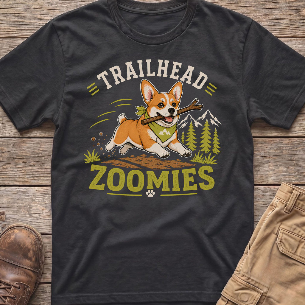 Corgi with a stick wearing a bandana, text "TRAILHEAD ZOOMIES"