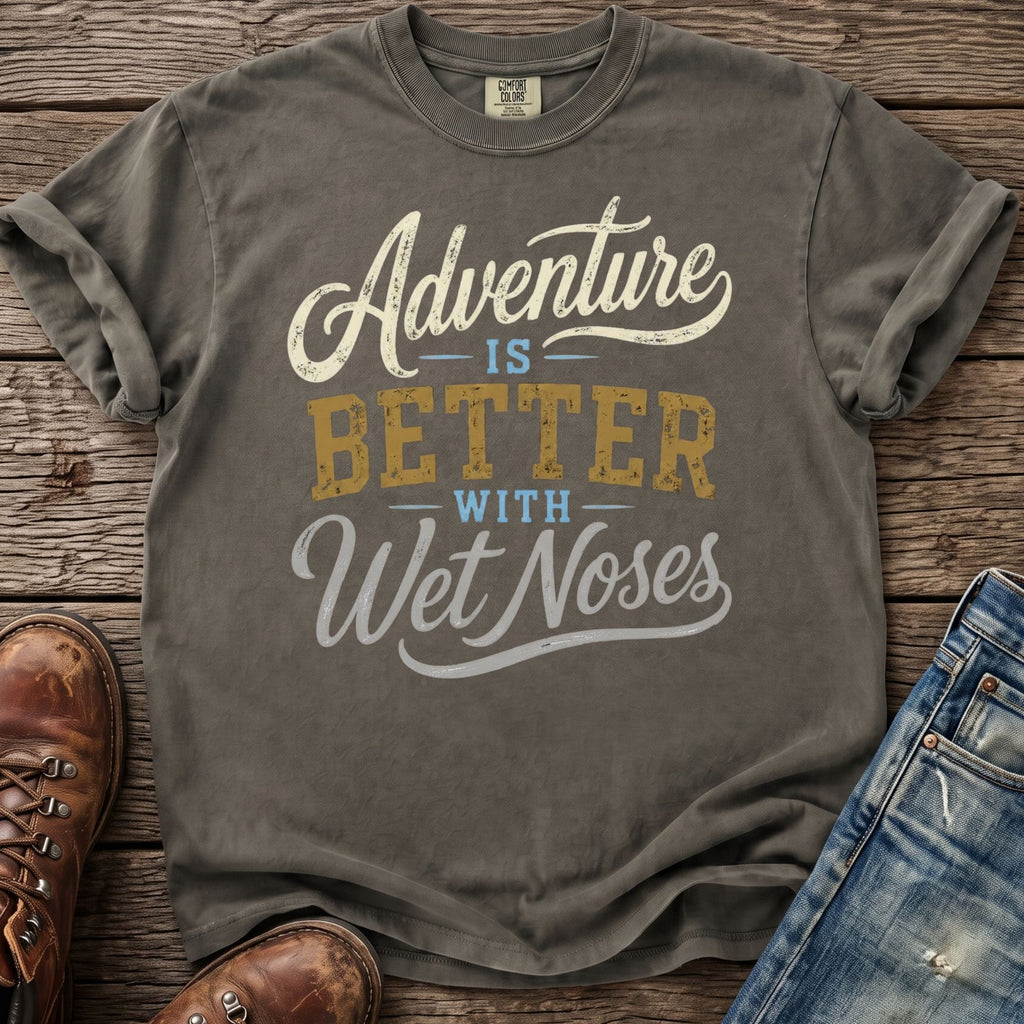 Gray t-shirt with "Adventure is better with wet noses" text, jeans, and boots.