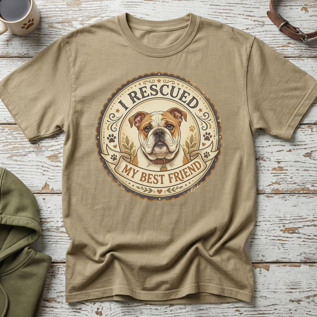 English bulldog graphic on a tan t-shirt with text "I Rescued My Best Friend".
