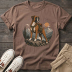 Brown t-shirt with a boxer dog wearing a backpack in a mountain landscape.
