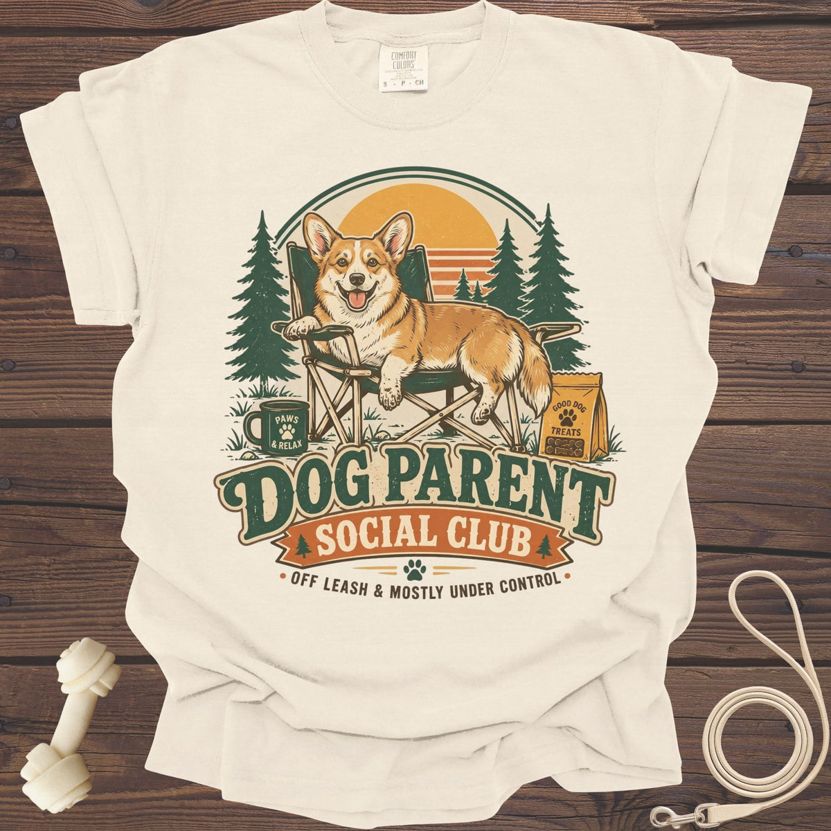 Cream t-shirt with corgi relaxing in camping chair, "Dog Parent Social Club" text.