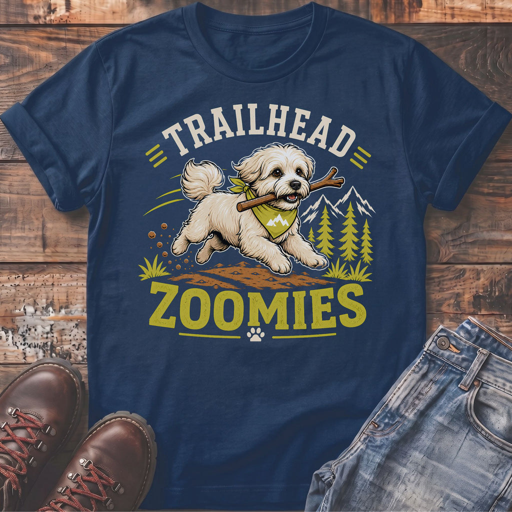 Navy t-shirt with a white dog running with a stick, text "TRAILHEAD ZOOMIES".