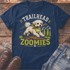 Navy t-shirt with a white dog running with a stick, text "TRAILHEAD ZOOMIES".