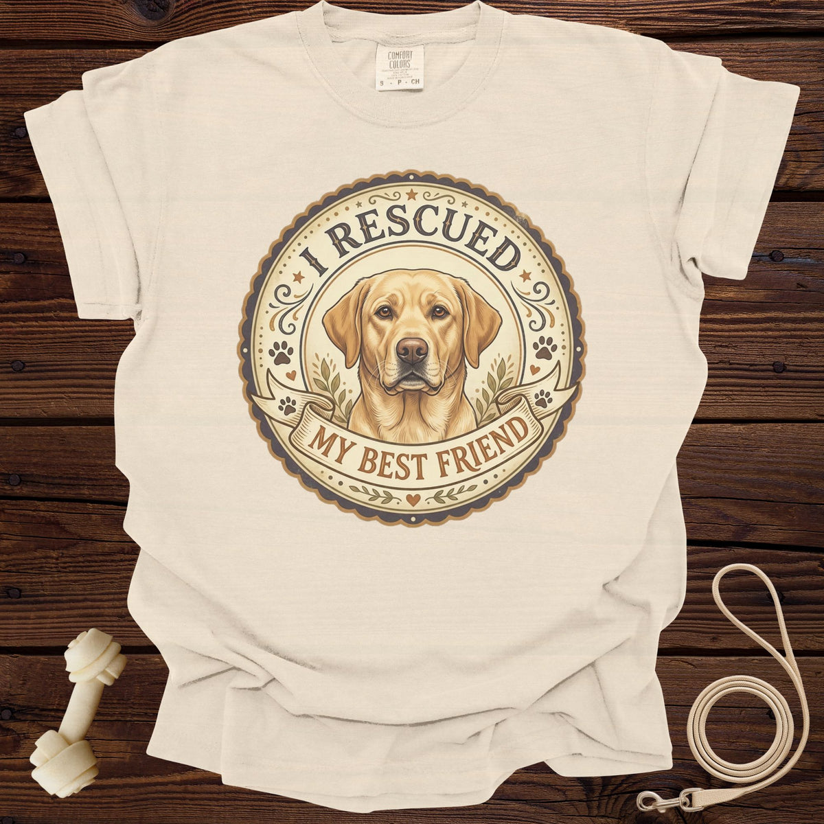 Cream t-shirt with distressed graphic of a yellow lab and text "I RESCUED MY BEST FRIEND".