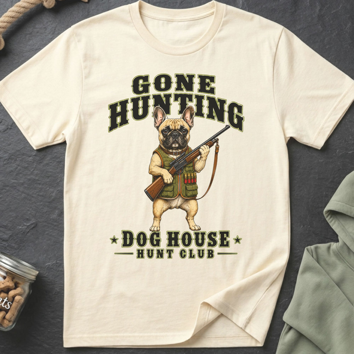 French bulldog wearing hunting vest holding rifle with text "Gone Hunting Dog House Hunt Club".