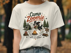 White t-shirt with "Camp Zoomie For Good Dogs With Bad Brakes" graphic.