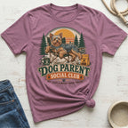 Yorkshire terrier relaxing in camping scene on "Dog Parent Social Club" t-shirt.