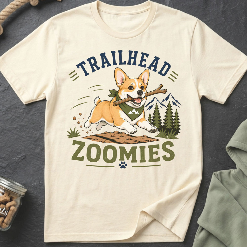 Cream t-shirt with a corgi running with a stick, text reads "TRAILHEAD ZOOMIES".
