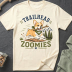 Cream t-shirt with a corgi running with a stick, text reads "TRAILHEAD ZOOMIES".