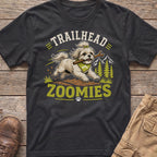 T-shirt with a shaggy dog running with a stick, text "TRAILHEAD ZOOMIES"