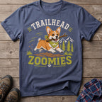 Corgi with a stick runs through mountains, with text "TRAILHEAD ZOOMIES".