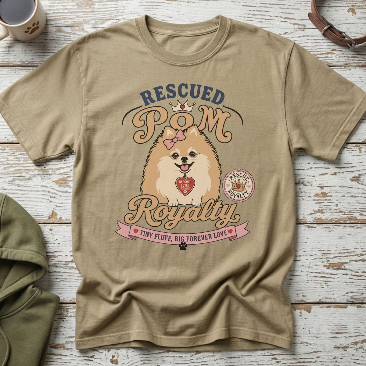 Tan t-shirt with "Rescued Pom Royalty" graphic and a Pomeranian dog.