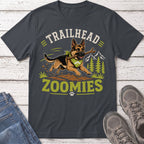 German Shepherd with stick and bandana, text "Trailhead Zoomies" and mountains