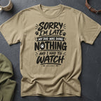Tan t-shirt with black text: "Sorry I'm late, my dog was doing nothing and I had to watch."