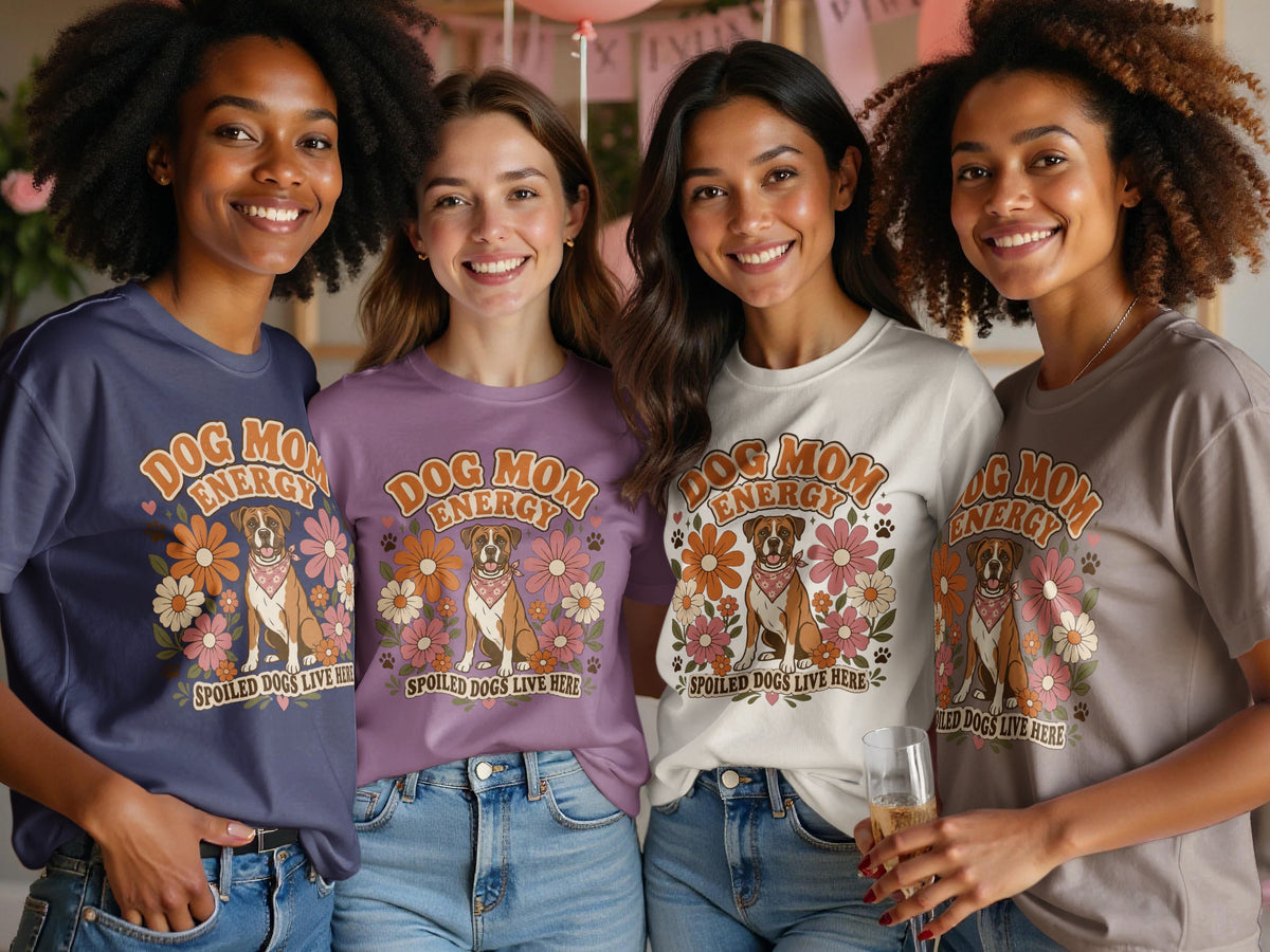 Four women in different colored shirts display a retro graphic of a boxer dog and flowers.