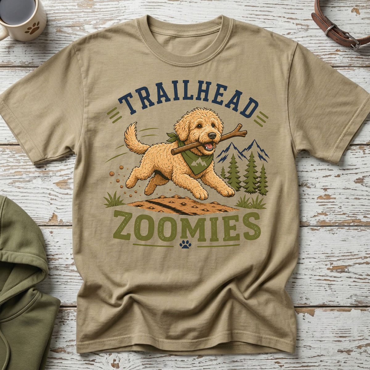 Tan t-shirt with dog graphic and text "TRAILHEAD ZOOMIES"