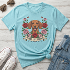 Light blue t-shirt with a dachshund and roses graphic that says "Loyal Love Blooms."