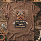 Yorkshire terrier mugshot graphic on a brown t-shirt reads "Most Wanted Zoomie".