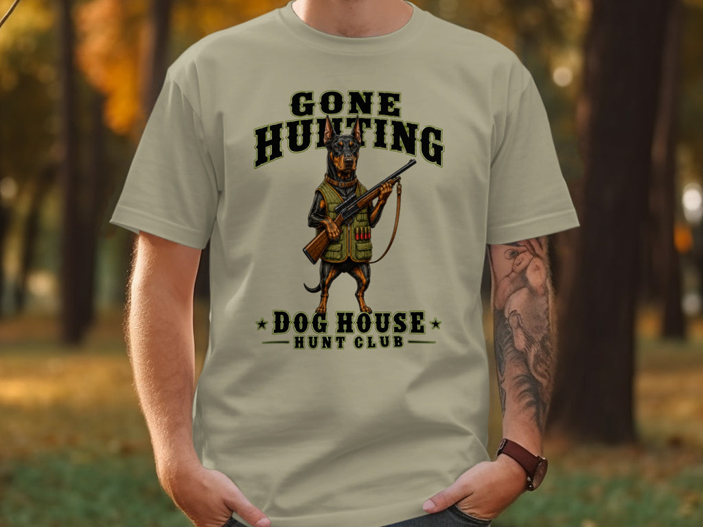 T-shirt graphic: dog in hunting gear with "Gone Hunting Dog House Hunt Club" text.