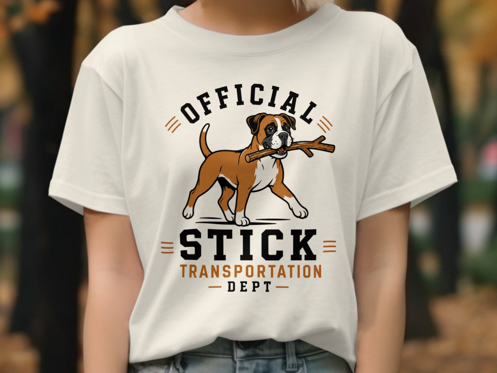 White t-shirt with graphic of a boxer dog carrying a stick, text "OFFICIAL STICK TRANSPORTATION DEPT."