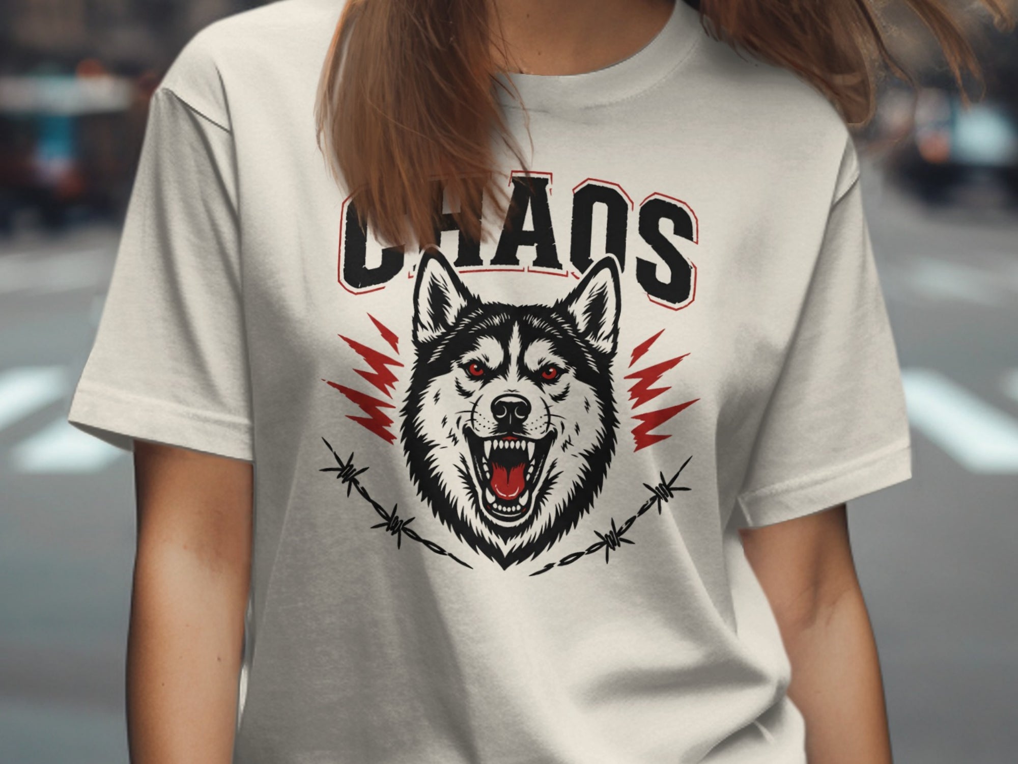 White t-shirt with "CHAOS" text and a fierce wolf head graphic.