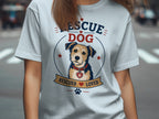 Light blue t-shirt with a rescue dog graphic and "RESCUE DOG" text.