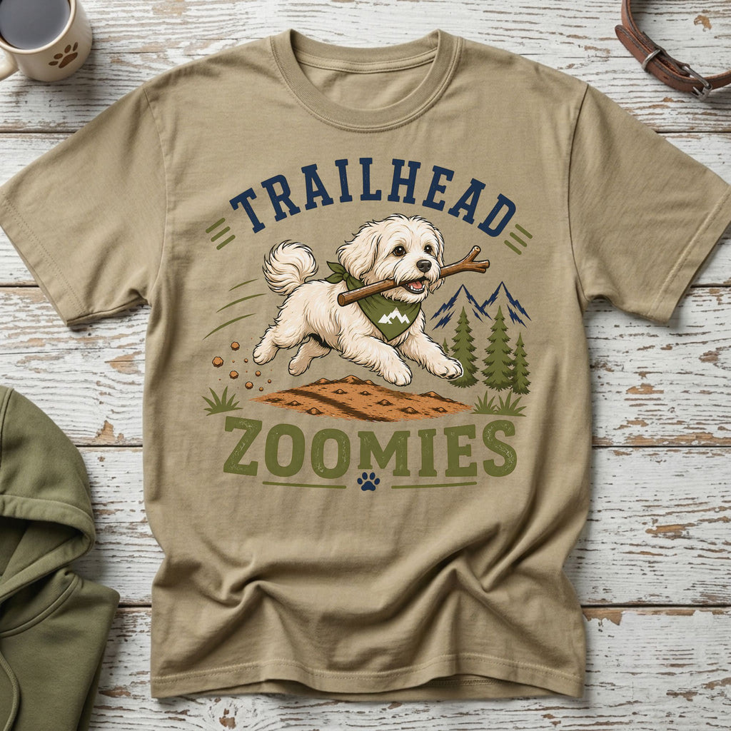 T-shirt graphic: dog with stick, "TRAILHEAD ZOOMIES" text, mountains, trees.