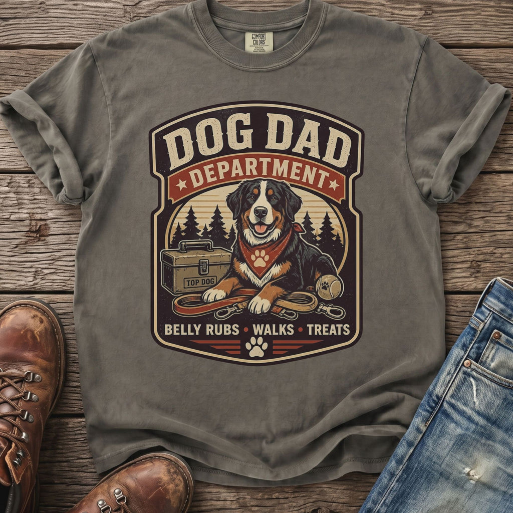 Grey t-shirt with a "Dog Dad Department" graphic featuring a dog and park elements.