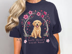 Golden retriever sits under cherry blossoms with text "Soft Heart Loyal Soul."