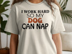 Light cream t-shirt with black text: "I WORK HARD SO MY DOG CAN NAP."