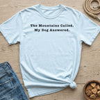 Light blue t-shirt with black text: "The Mountains Called. My Dog Answered."