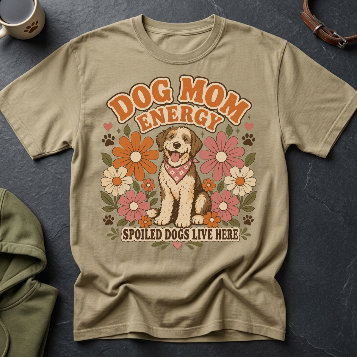Tan t-shirt with "Dog Mom Energy" and a dog sitting among flowers.